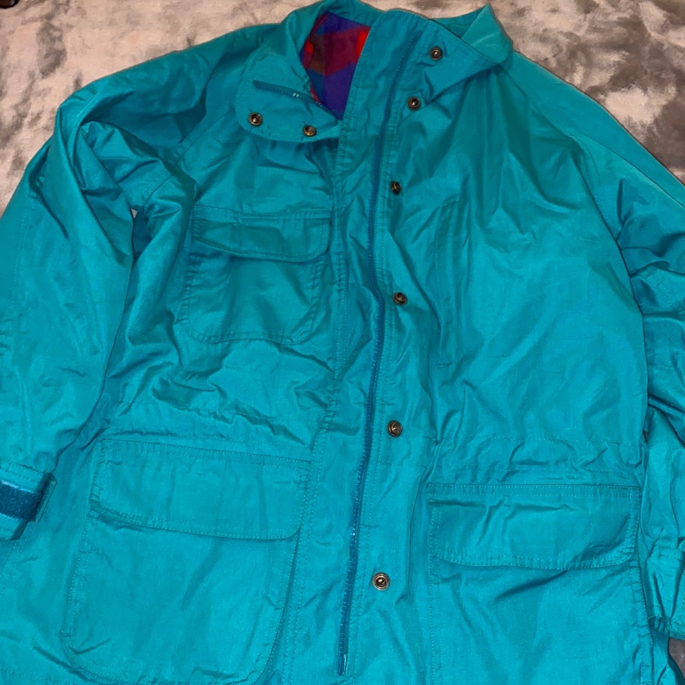 Eddie Bauer women's coat. Turquoise color. Flannel interior lining.